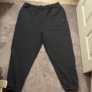 Gymshark Black Track Pants with Tapered Leg and Elastic Cuffs